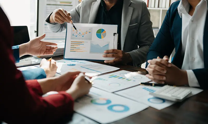 Business meeting with graphs