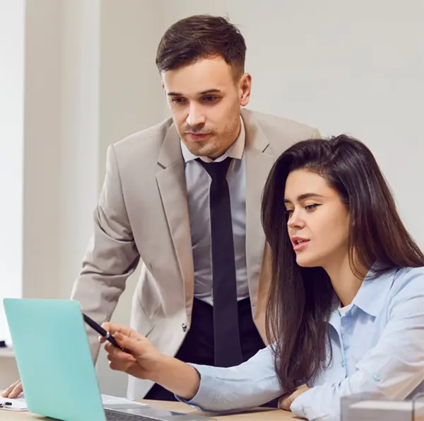 Interns working at laptop